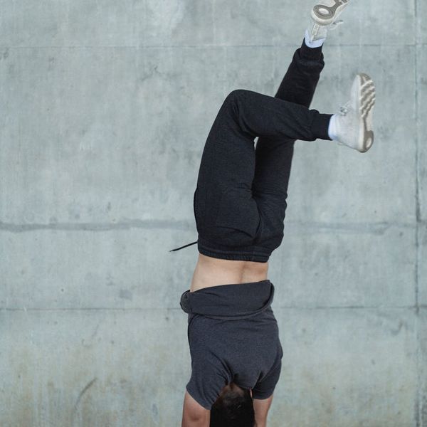 Man performing a dynamic bodyweight exercise with controlled motion.